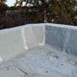 Full flat roof, chimney, and gutter residential restoration project