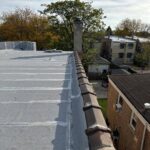Full flat roof, chimney, and gutter residential restoration project
