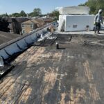 Full flat roof, chimney, and gutter residential restoration project