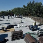 Full flat roof, chimney, and gutter residential restoration project